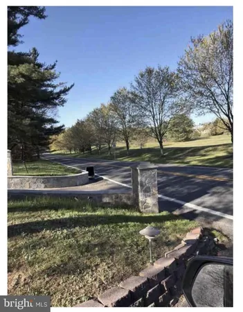 a view of backyard with green space
