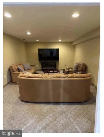 a room with furniture and a flat screen tv