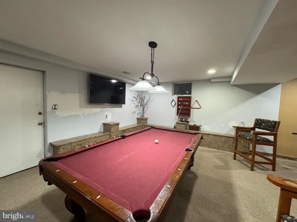 a room with furniture and flat screen tv