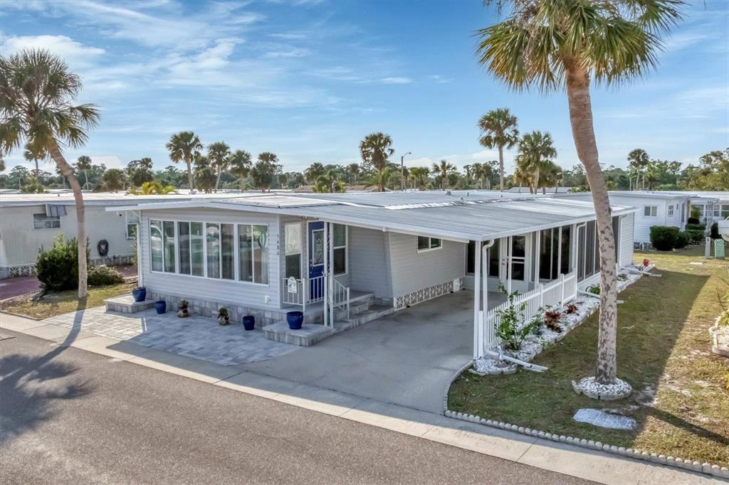 5680 Teahouse Road Venice, FL 34293 - Photo 1 of 1 a view of a house with backyard and sitting area