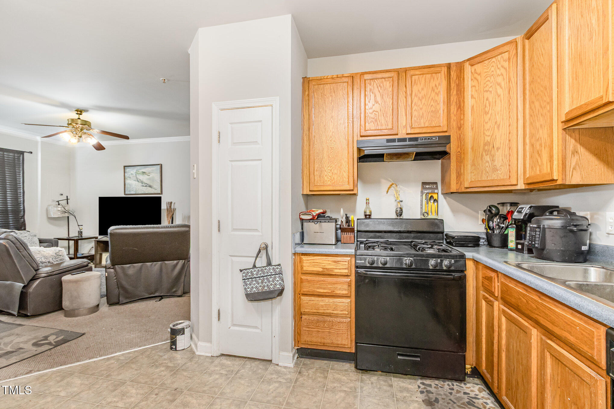 2220 Raven Road, Unit 104 Raleigh, NC 27614 - Photo 12 of 22 a kitchen with stainless steel appliances granite countertop a stove a sink and a refrigerator