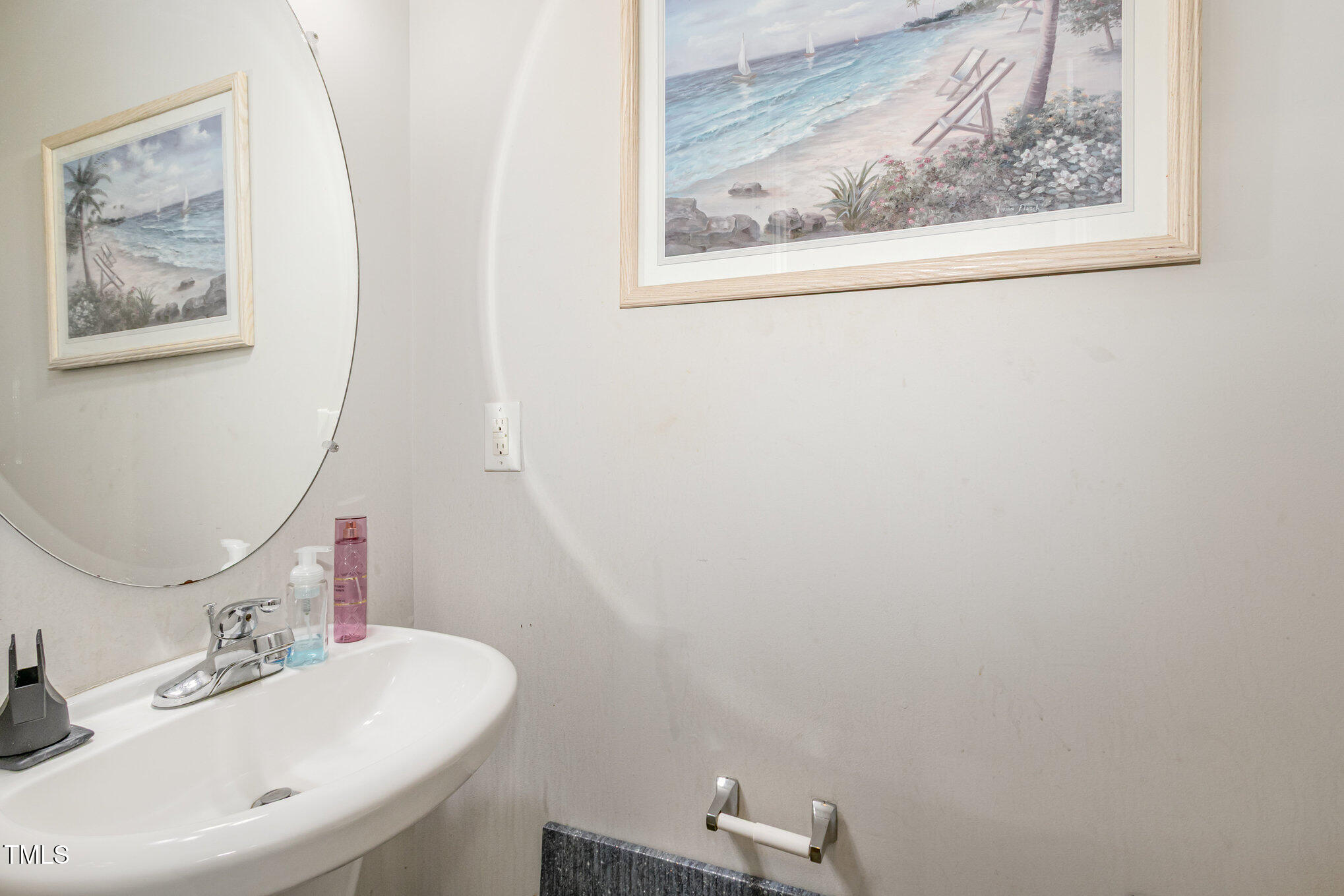 2220 Raven Road, Unit 104 Raleigh, NC 27614 - Photo 15 of 22 a bathroom with a sink and mirror