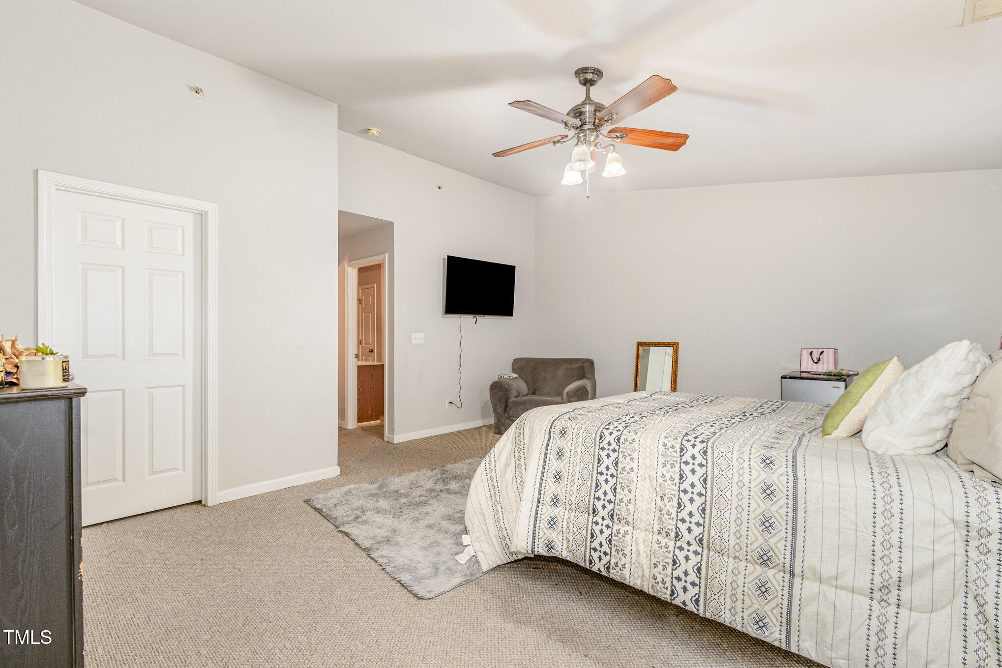 2220 Raven Road, Unit 104 Raleigh, NC 27614 - Photo 19 of 22 a bedroom with a large bed and a chandelier