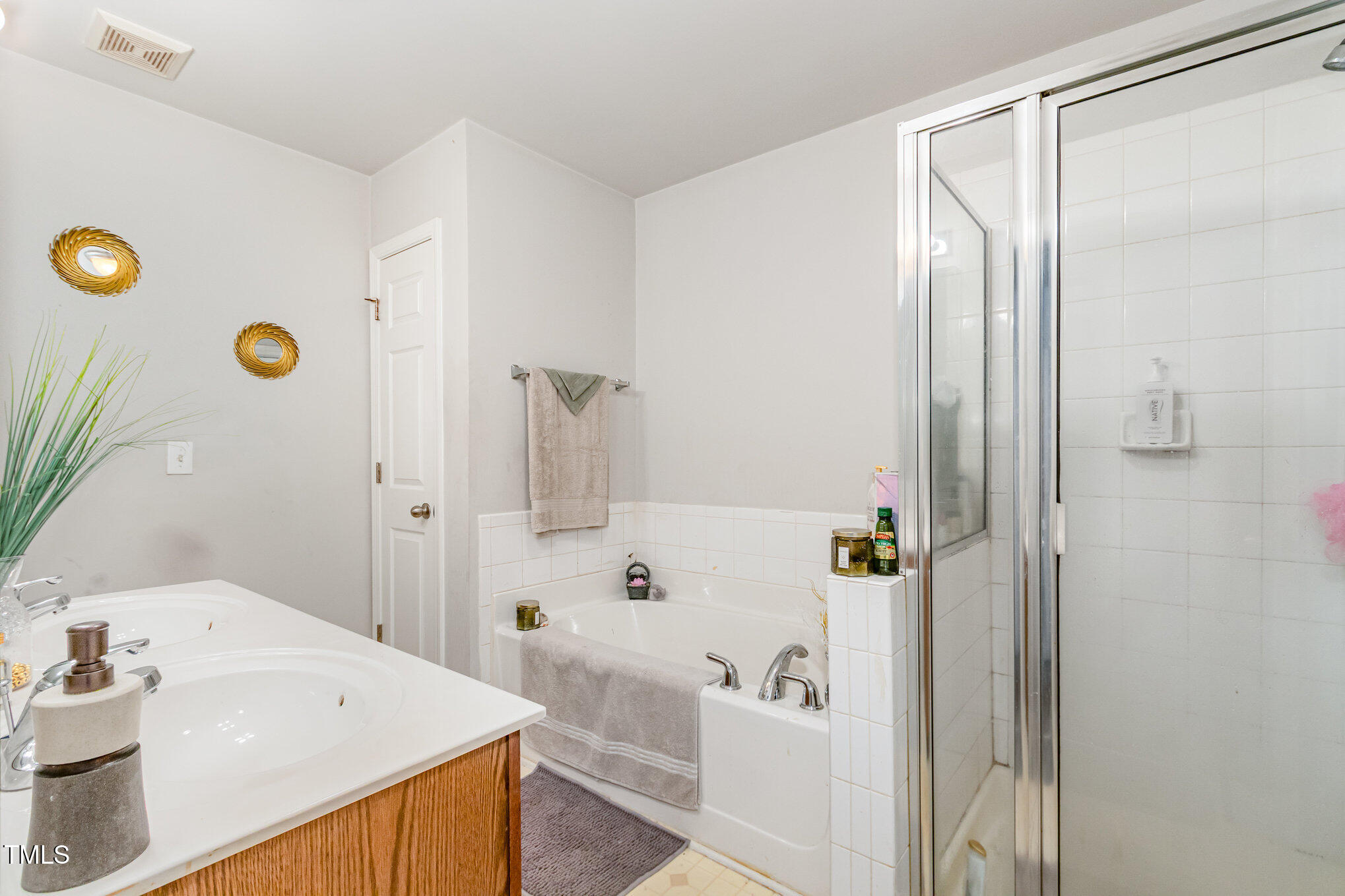 2220 Raven Road, Unit 104 Raleigh, NC 27614 - Photo 21 of 22 a bathroom with a tub and shower