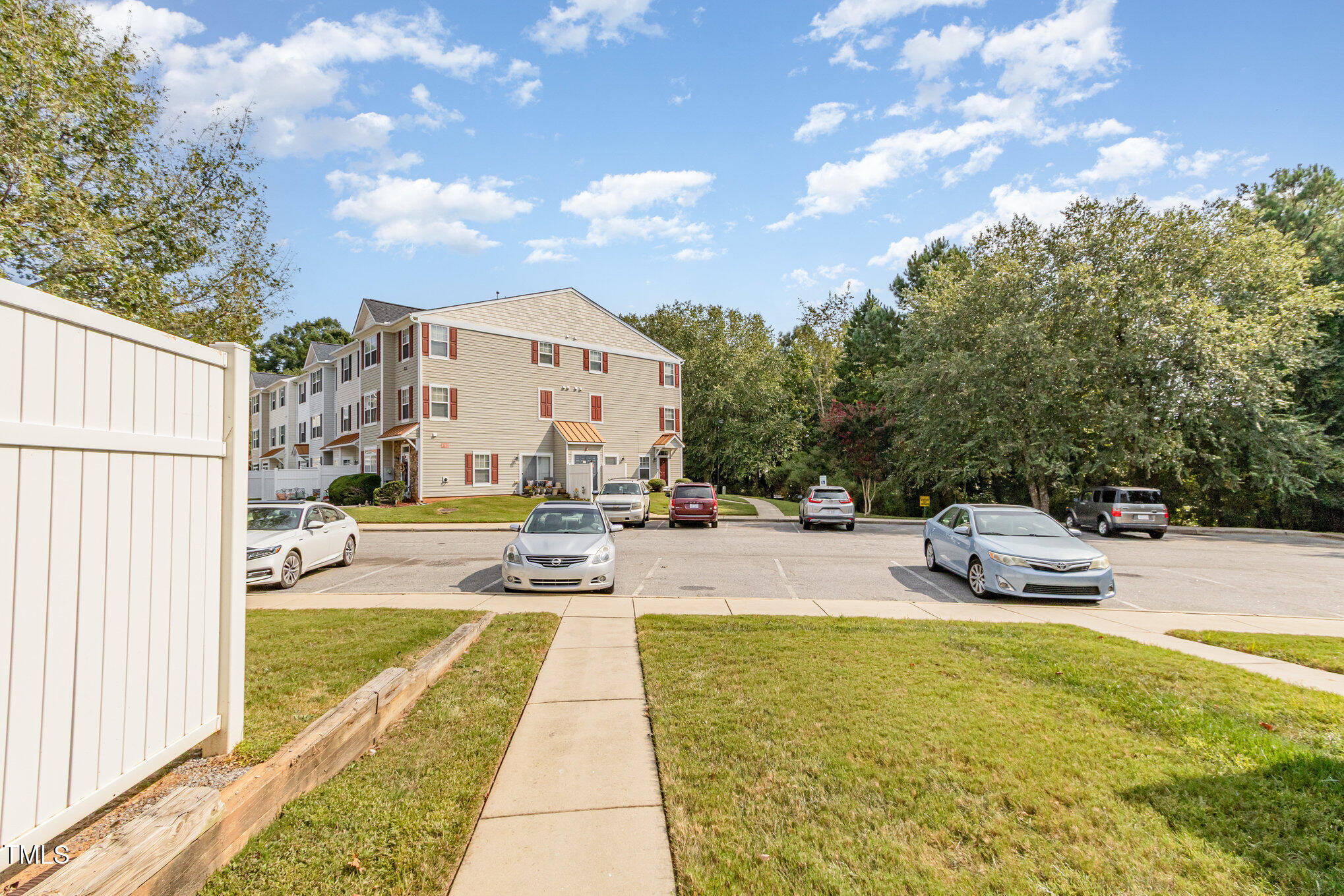 2220 Raven Road, Unit 104 Raleigh, NC 27614 - Photo 3 of 22 a view of a swimming pool with a lounge chair