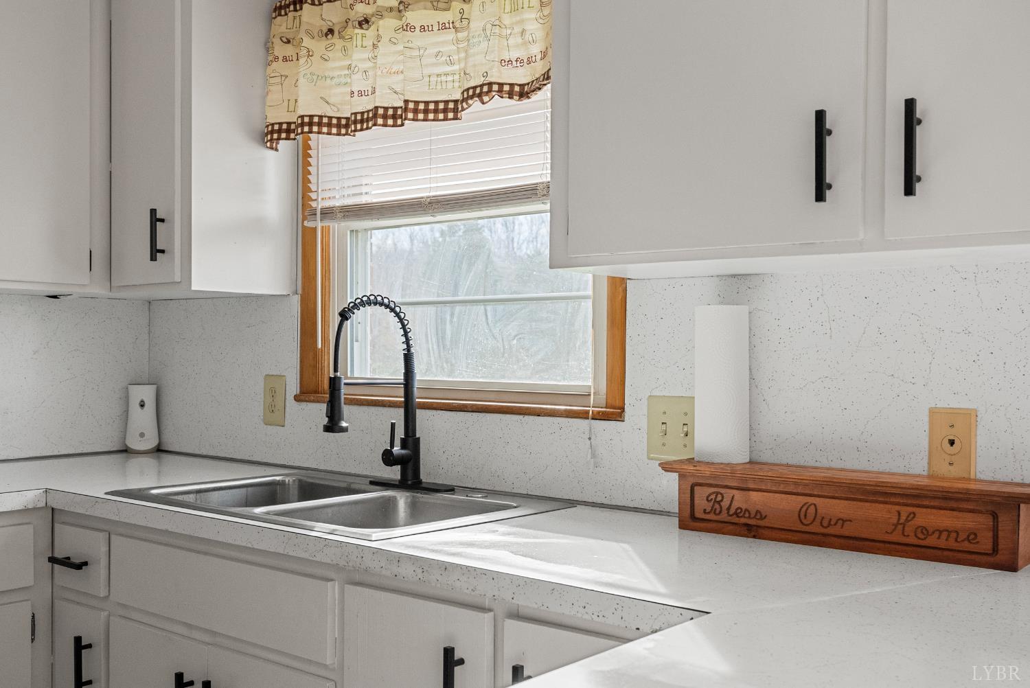 294 Spring Garden Road Monroe, VA 24574 - Photo 11 of 56 a kitchen with a sink and a window