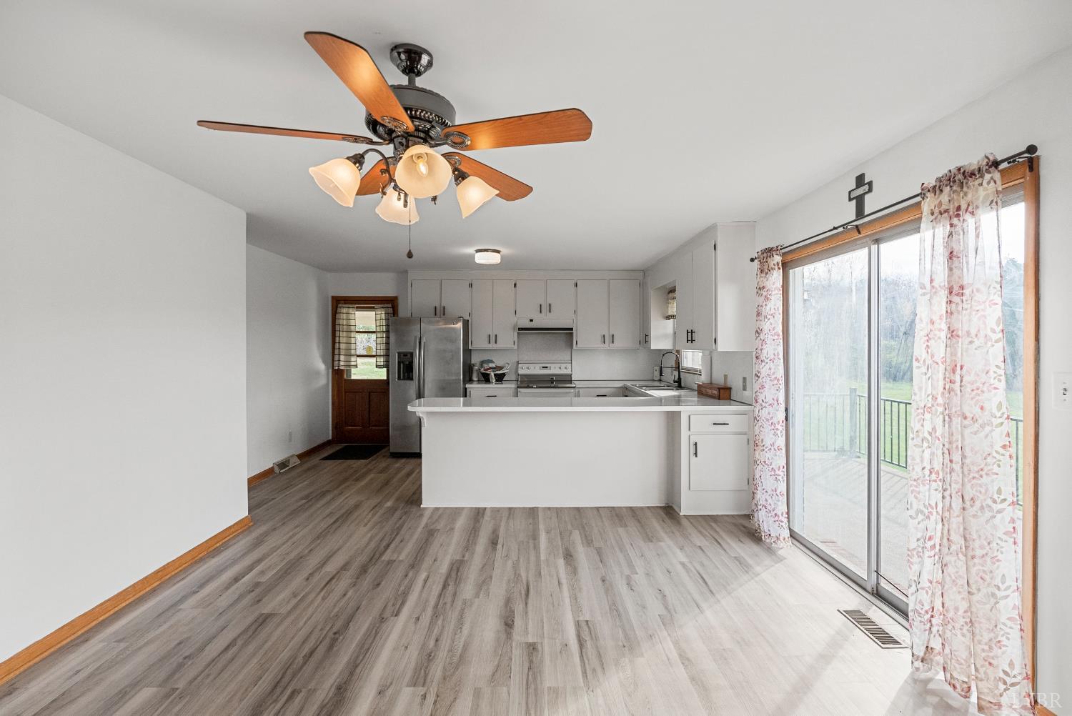 294 Spring Garden Road Monroe, VA 24574 - Photo 15 of 56 a view of a kitchen with wooden floor
