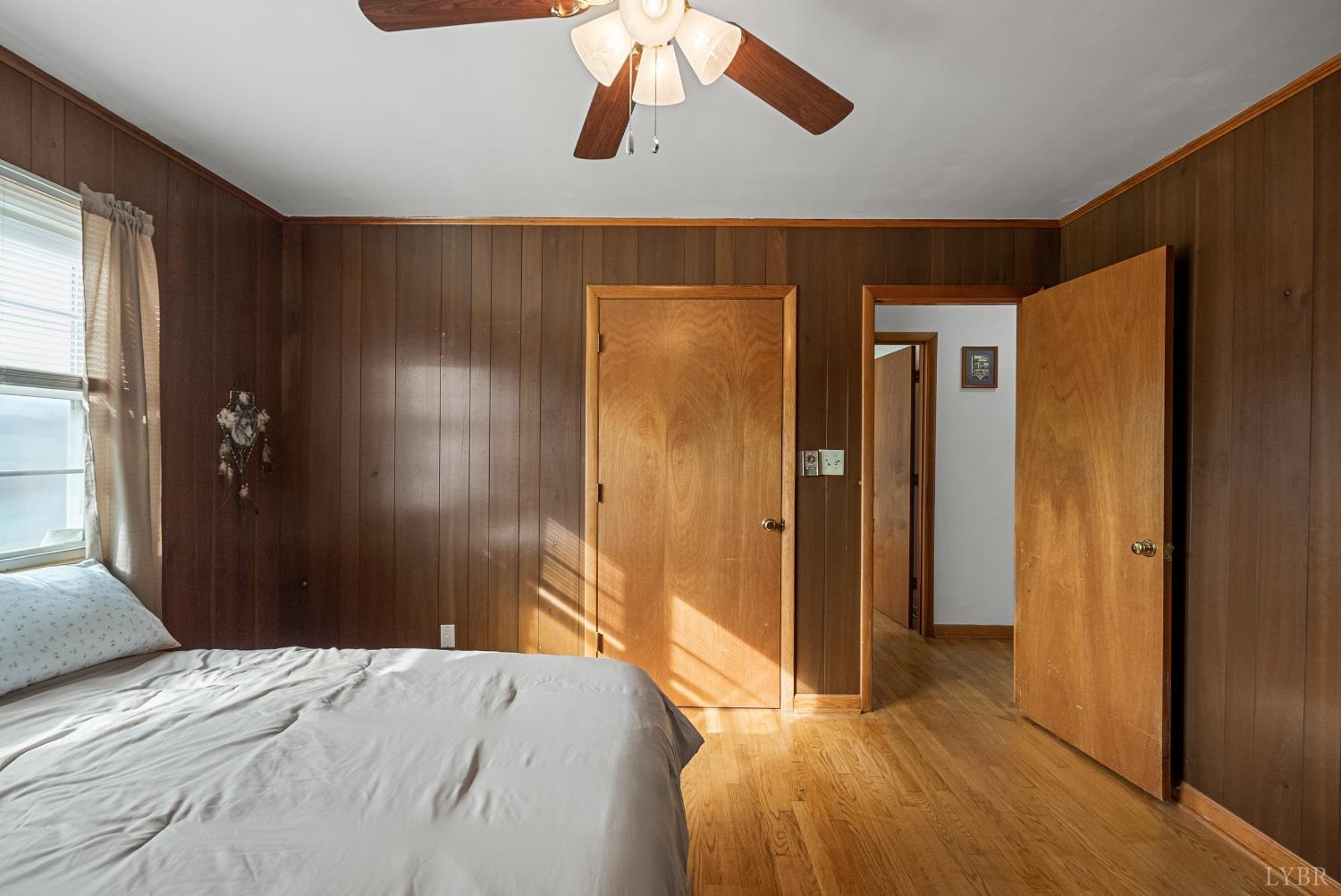 294 Spring Garden Road Monroe, VA 24574 - Photo 17 of 56 a bedroom with a bed and a large mirror