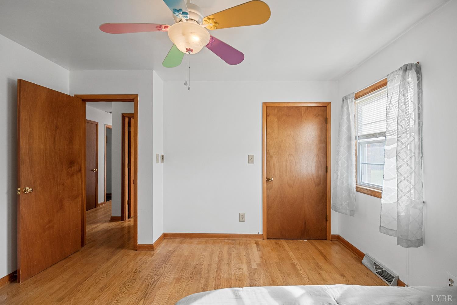 294 Spring Garden Road Monroe, VA 24574 - Photo 19 of 56 wooden floor in an empty room with a window