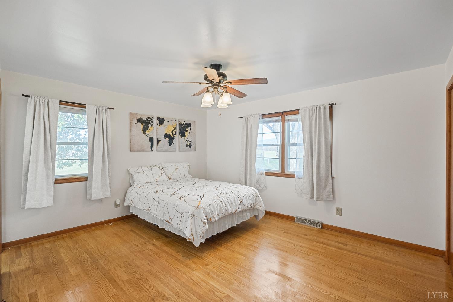 294 Spring Garden Road Monroe, VA 24574 - Photo 21 of 56 a bedroom with a bed chandelier and a window