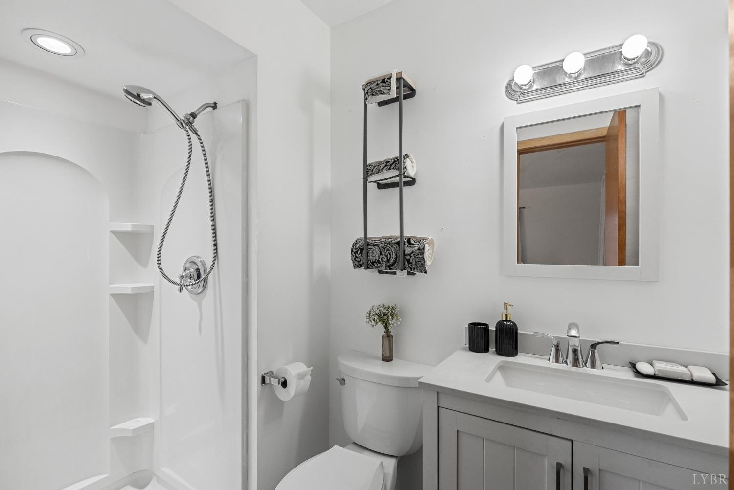 294 Spring Garden Road Monroe, VA 24574 - Photo 23 of 56 a bathroom with a sink a toilet and shower