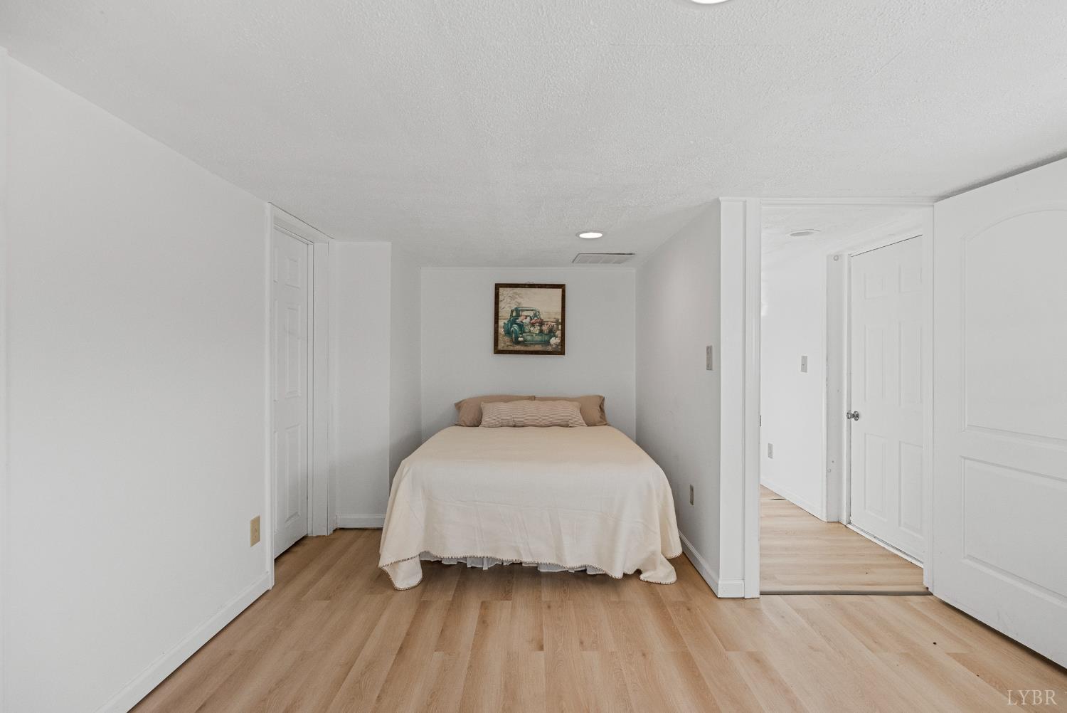 294 Spring Garden Road Monroe, VA 24574 - Photo 34 of 56 a bedroom with a bed and wooden floor