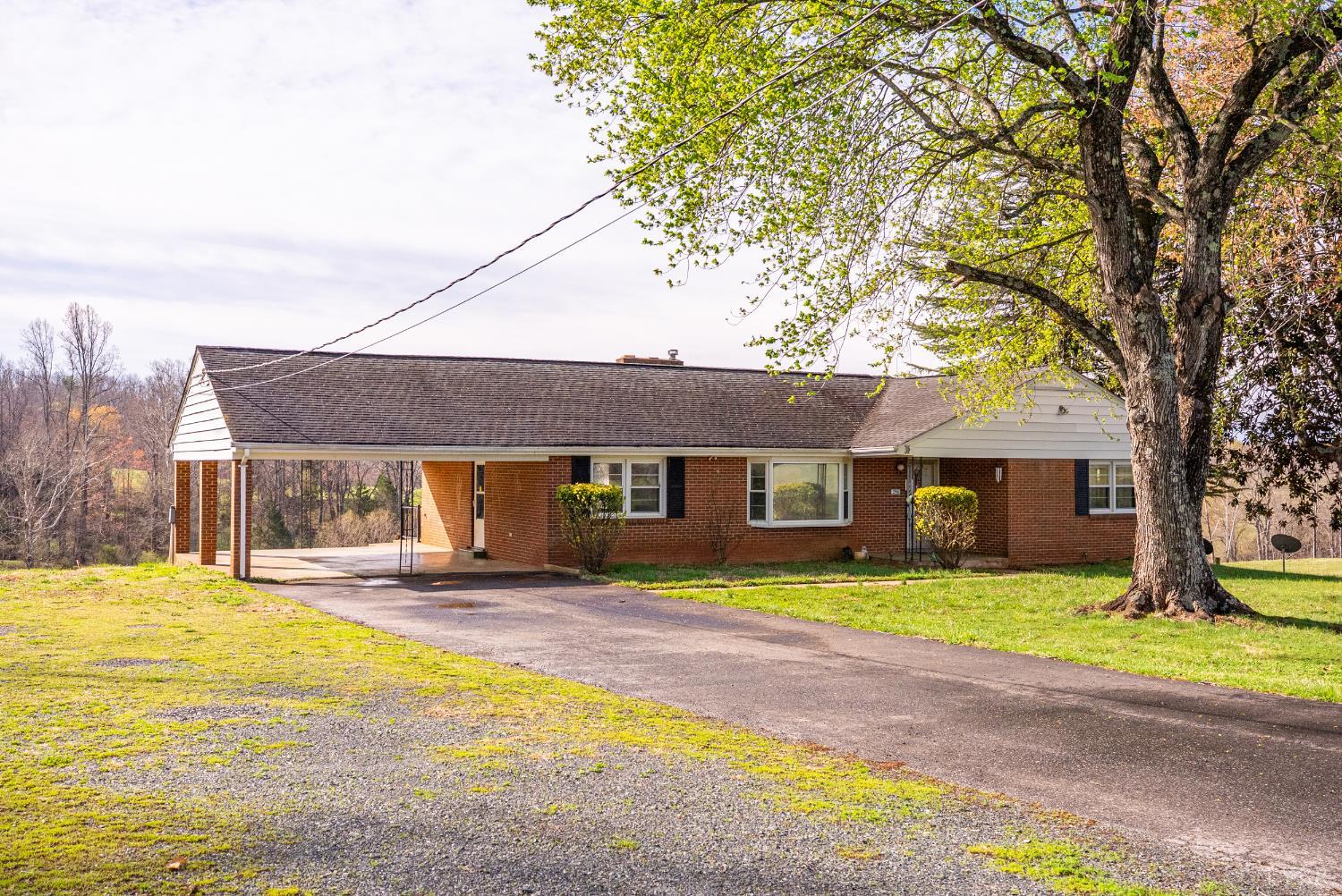 294 Spring Garden Road Monroe, VA 24574 - Photo 37 of 56 a house view with a sitting space and garden