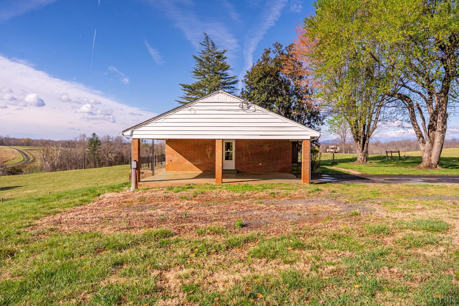 294 Spring Garden Road Monroe, VA 24574 - Photo 40 of 56 a view of a house with backyard and tree
