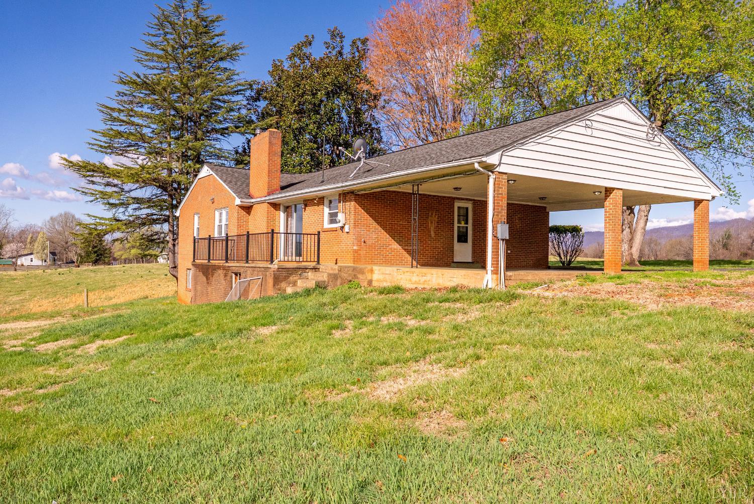 294 Spring Garden Road Monroe, VA 24574 - Photo 44 of 56 a front view of a house with a yard