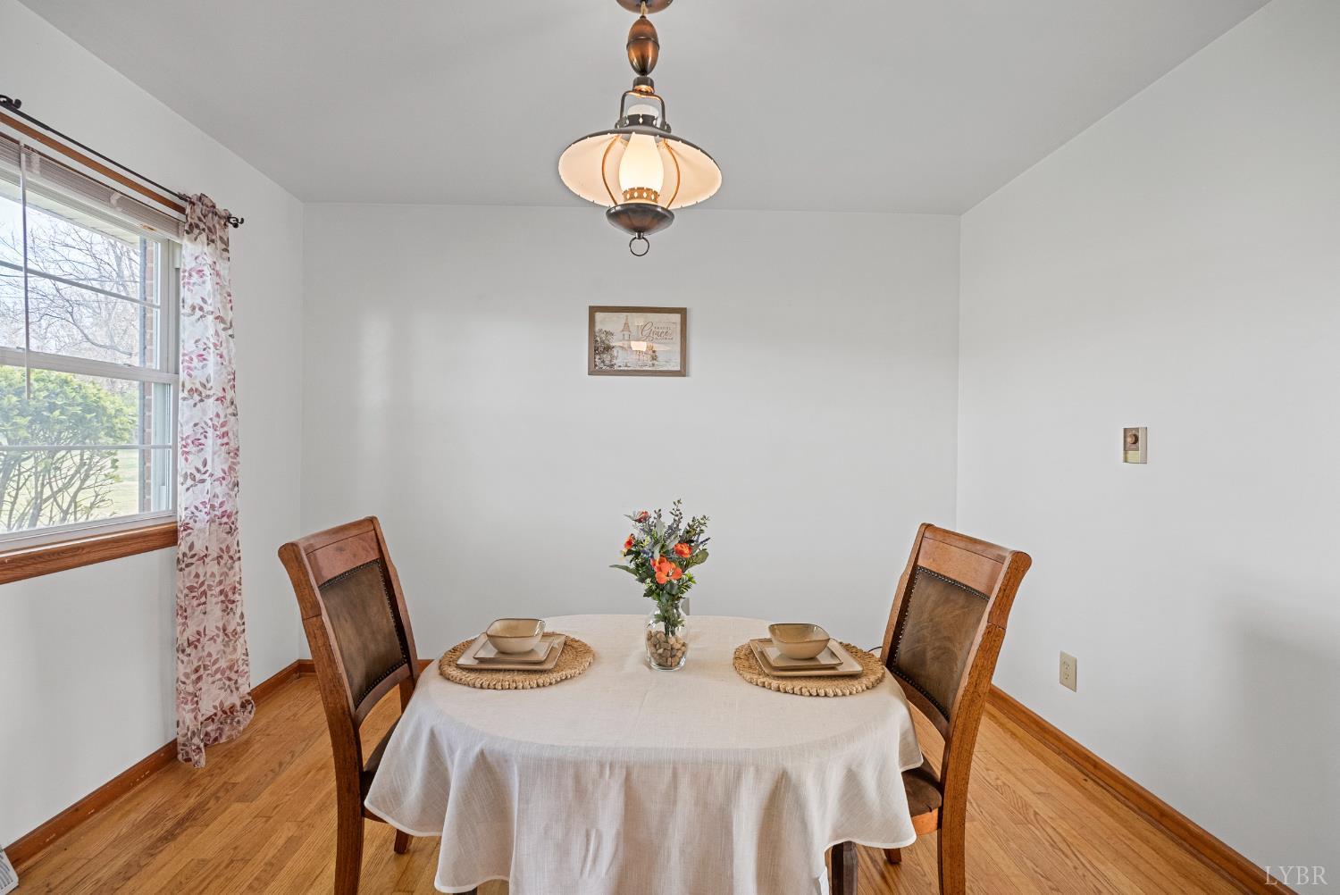 294 Spring Garden Road Monroe, VA 24574 - Photo 6 of 56 a view of a dining room with furniture and wooden floor