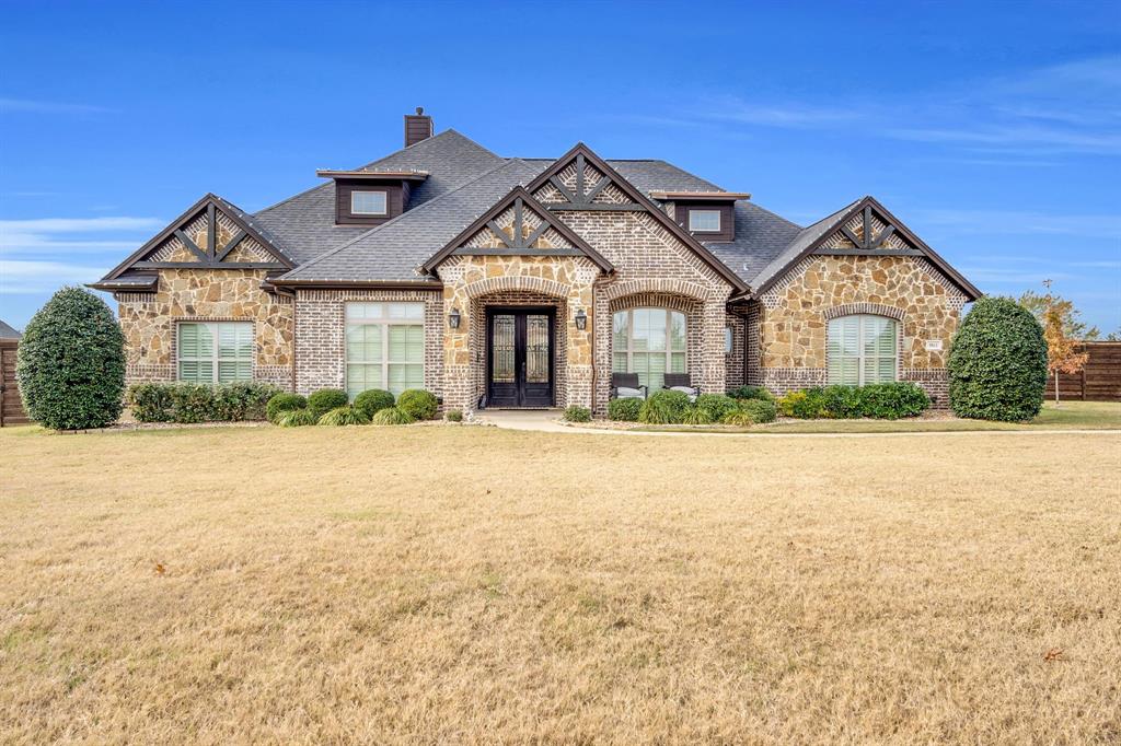 5811 Limestone Lane Midlothian, TX 76065 - Photo 1 of 40 a front view of a house with a yard