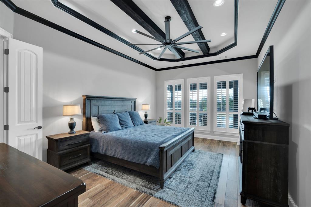 5811 Limestone Lane Midlothian, TX 76065 - Photo 11 of 40 a bedroom with a large bed and a large window