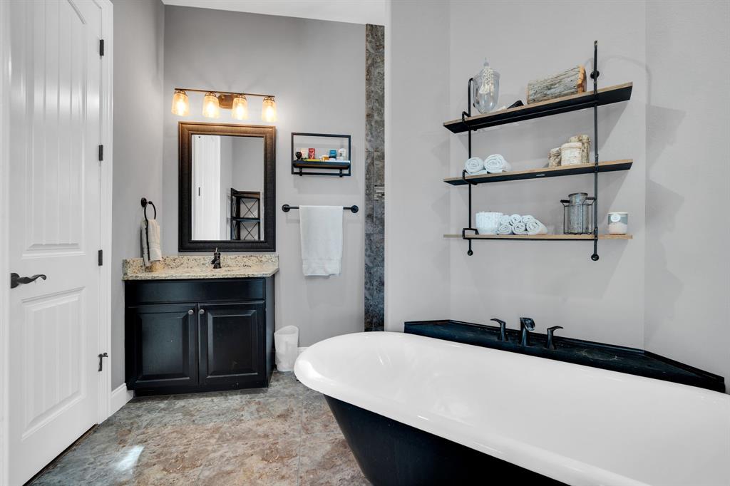 5811 Limestone Lane Midlothian, TX 76065 - Photo 14 of 40 a room with a sink and a mirror