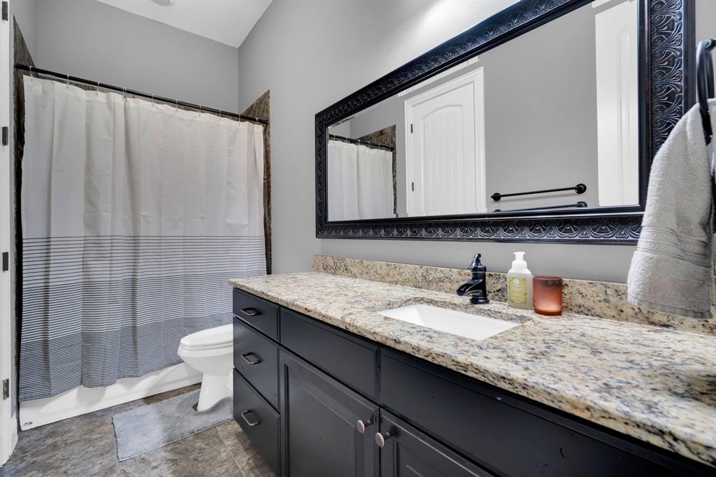 5811 Limestone Lane Midlothian, TX 76065 - Photo 16 of 40 a bathroom with a granite countertop sink and a mirror