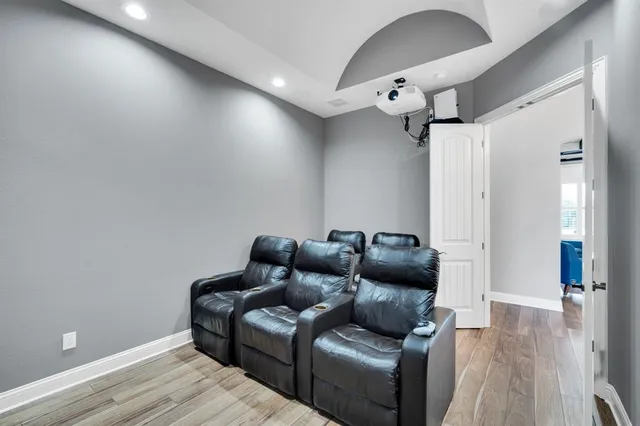 a room with counter top space a sink and windows