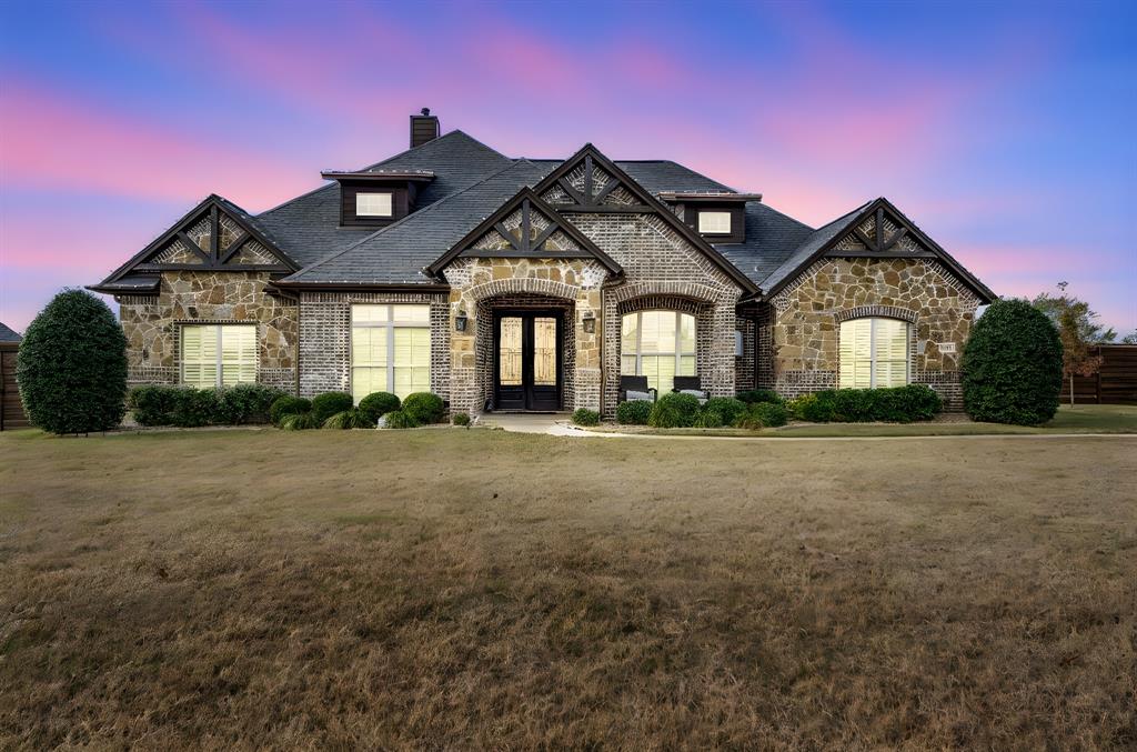 5811 Limestone Lane Midlothian, TX 76065 - Photo 2 of 40 a front view of a house with a garden