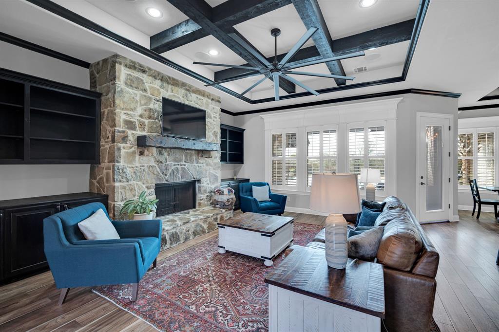 5811 Limestone Lane Midlothian, TX 76065 - Photo 29 of 40 a living room with furniture wooden floor and a fireplace
