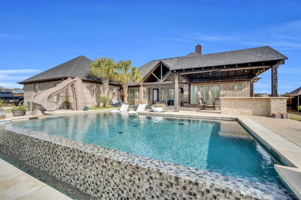 5811 Limestone Lane Midlothian, TX 76065 - Photo 8 of 40 a view of a house with pool and chairs