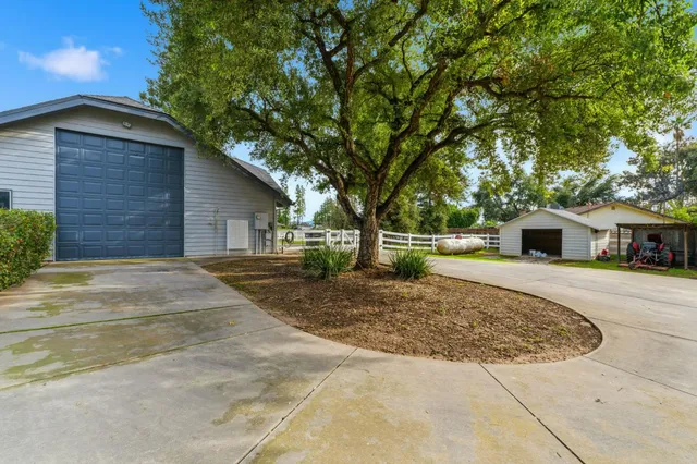 a living room with fireplace furniture and a flat screen tv