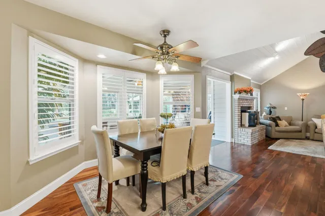 a kitchen with granite countertop a stove a sink and a cabinets