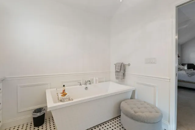 a living room with patio area view and a potted plant