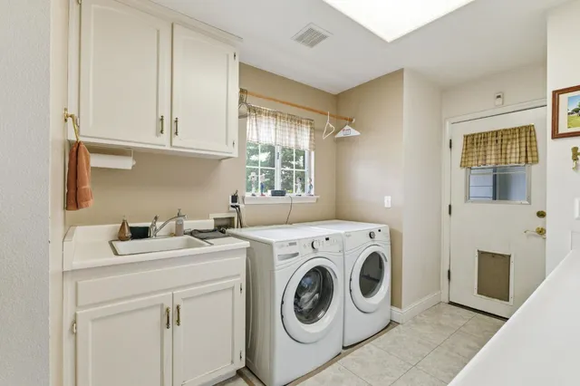 a living room with lots of furniture and gym equipment