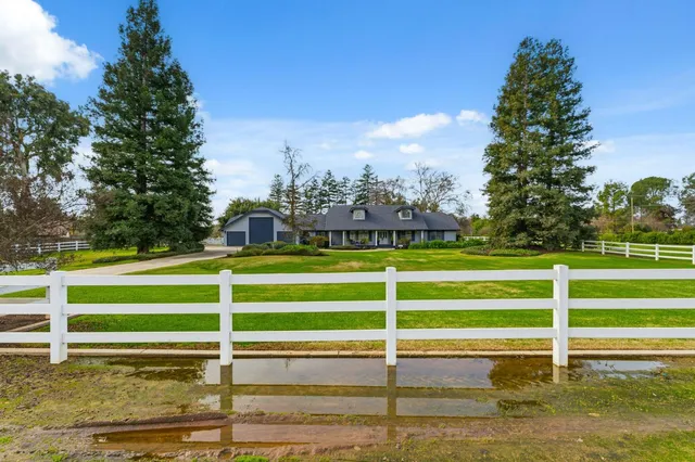 a front view of a house with yard
