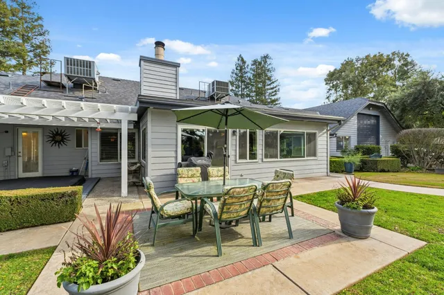a front view of a house with glass windows