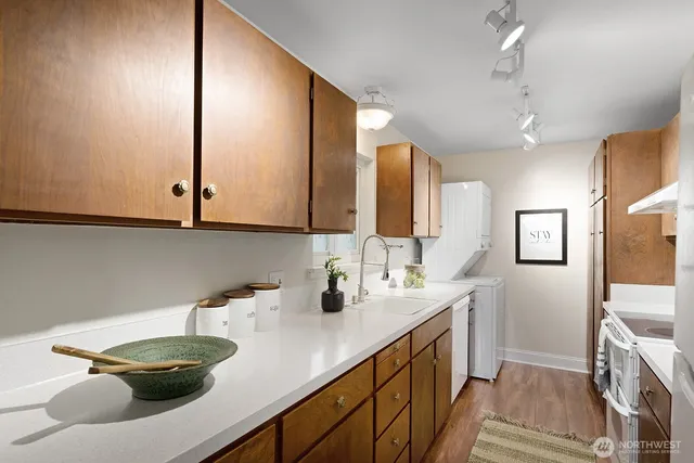 a bathroom with a sink a vanity and a mirror