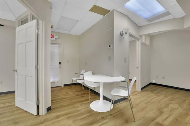 a workspace with furniture and wooden floor