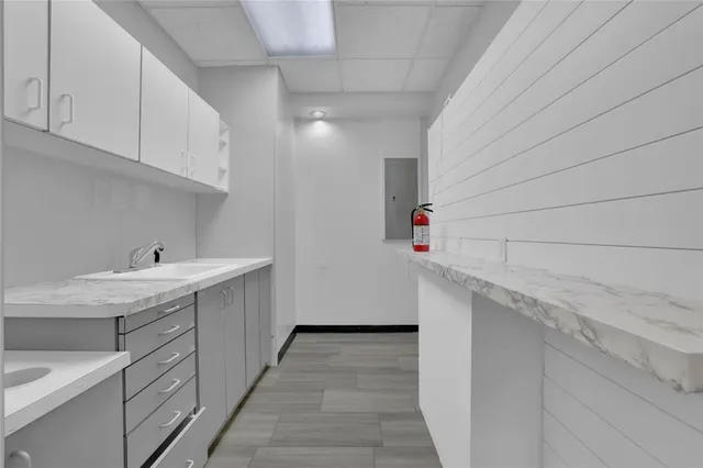 a utility room with cabinets