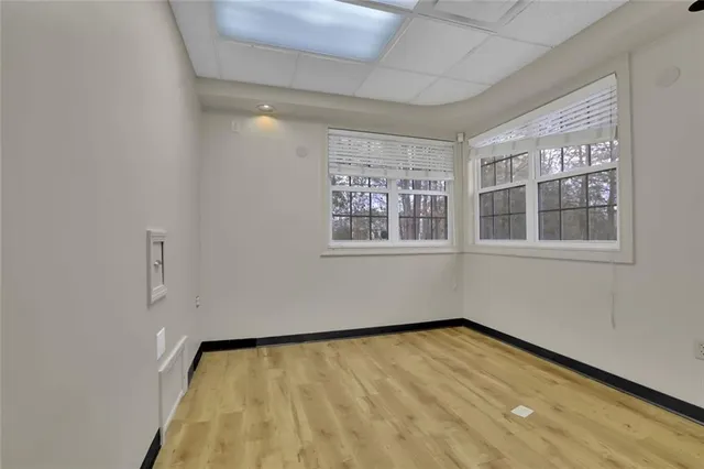 a view of empty room with windows