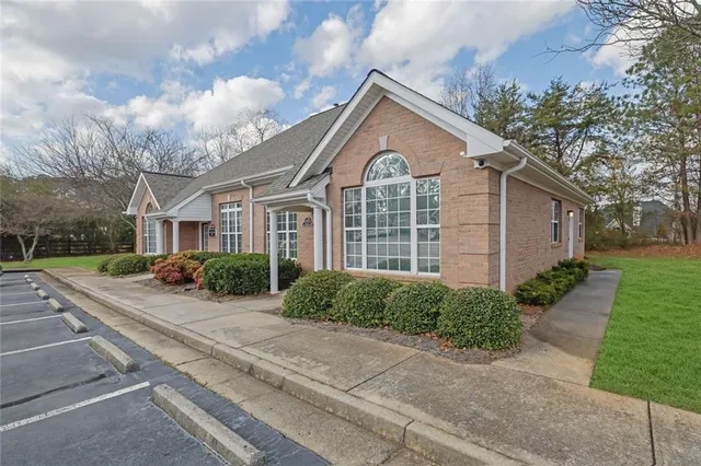 a view of front of house with a yard