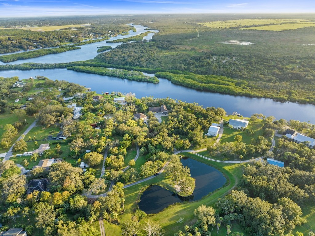 9598 Tortoise Lane Sebastian, FL 32976 - Photo 12 of 19 a view of lake with mountain
