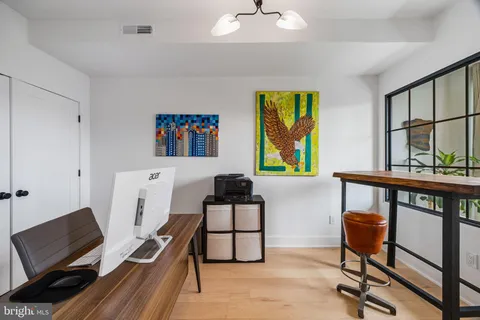 a kitchen with stainless steel appliances granite countertop a stove a sink dishwasher and cabinets with wooden floor