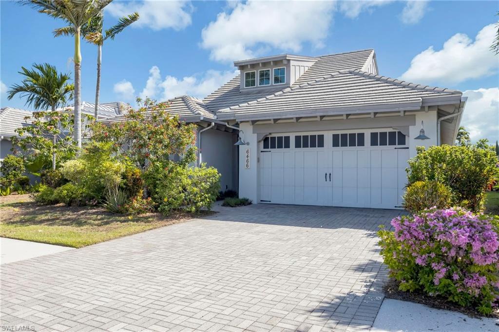 6466 Warwick Avenue Naples, FL 34113 - Photo 43 of 43 a house view with a garden space