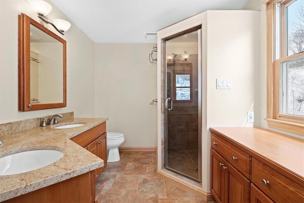 32 Canter Drive Sewickley, PA 15143 - Photo 14 of 25 a bathroom with a granite countertop sink and a mirror