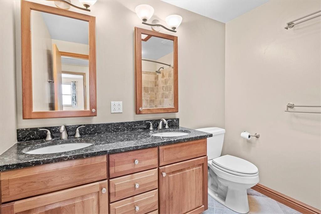 32 Canter Drive Sewickley, PA 15143 - Photo 17 of 25 a bathroom with a granite countertop toilet sink and mirror
