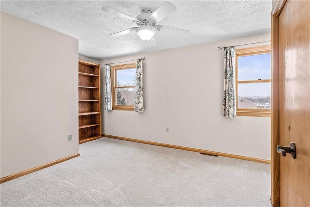 32 Canter Drive Sewickley, PA 15143 - Photo 20 of 25 an empty room with windows and fan