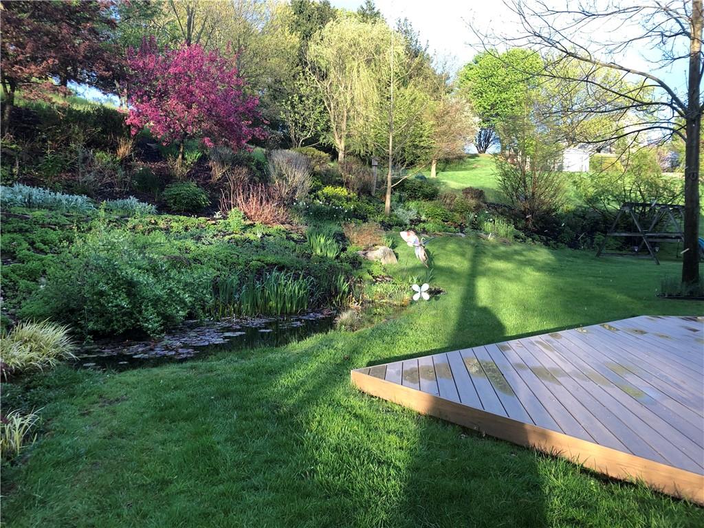 32 Canter Drive Sewickley, PA 15143 - Photo 23 of 25 a view of a backyard with a garden