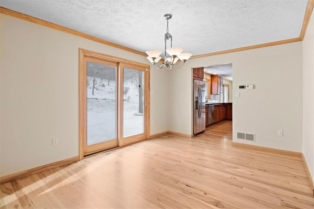 32 Canter Drive Sewickley, PA 15143 - Photo 4 of 25 a view of a livingroom with a chandelier fan and refrigerator