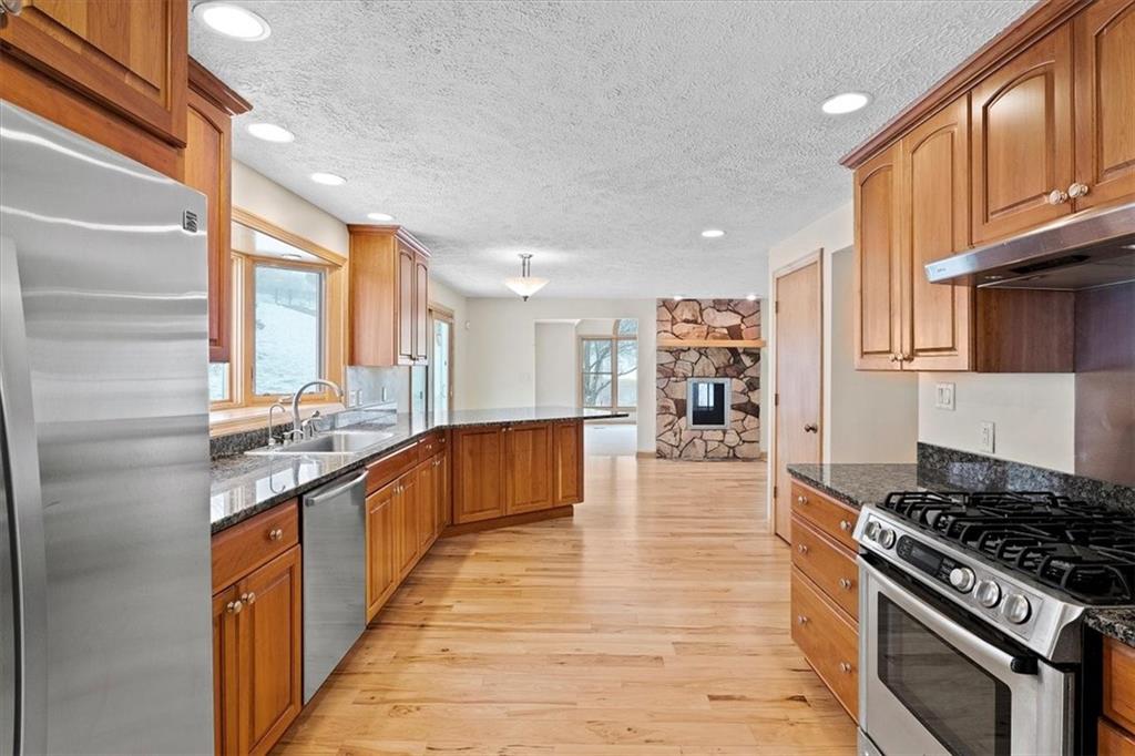 32 Canter Drive Sewickley, PA 15143 - Photo 6 of 25 a large kitchen with stainless steel appliances granite countertop a stove and a sink