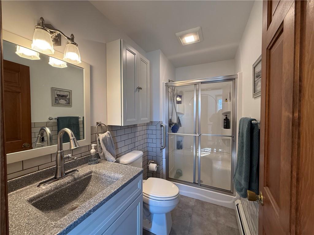 172 Valley Road Cranberry, PA 16319 - Photo 16 of 50 a bathroom with a sink toilet and shower