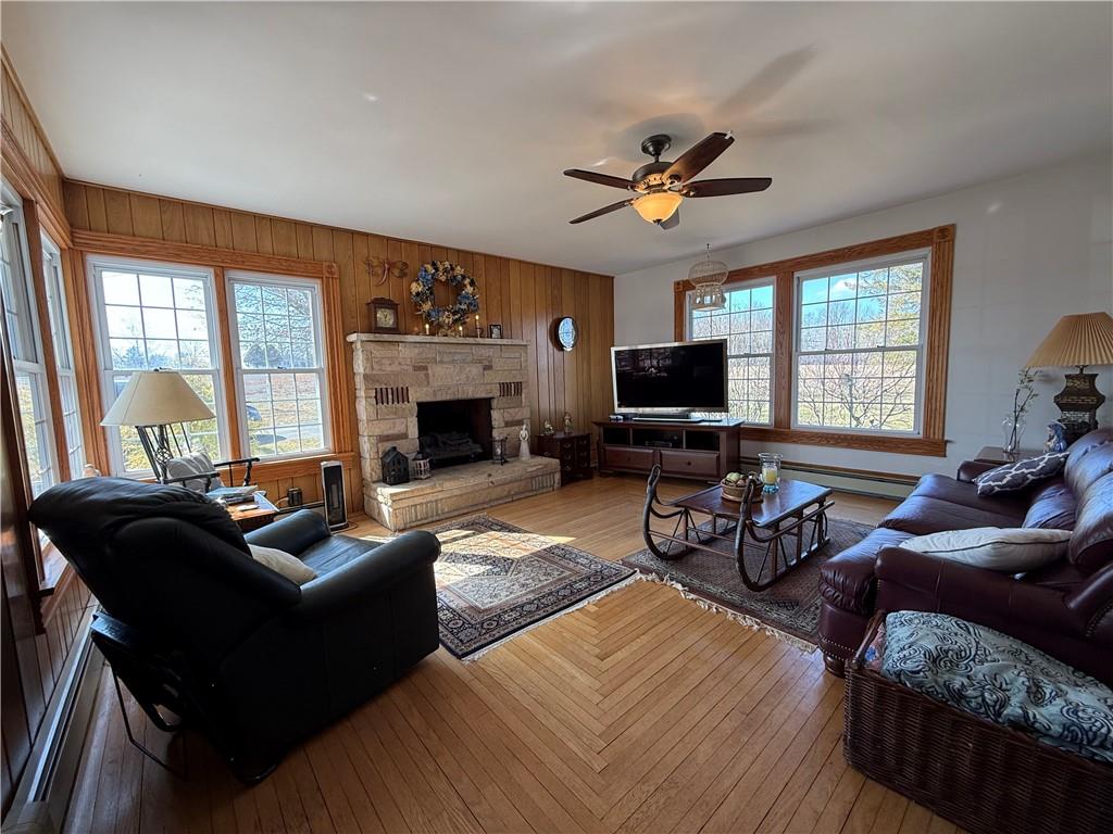 172 Valley Road Cranberry, PA 16319 - Photo 18 of 50 a living room with furniture a fireplace and a flat screen tv